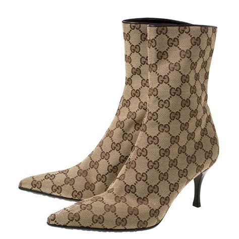 gucci gg canvas ankle boots|Gucci monogram thigh high boots.